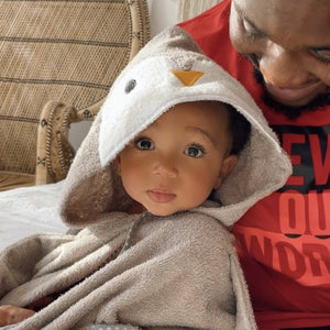 daddy with baby wrapped in penguin towel